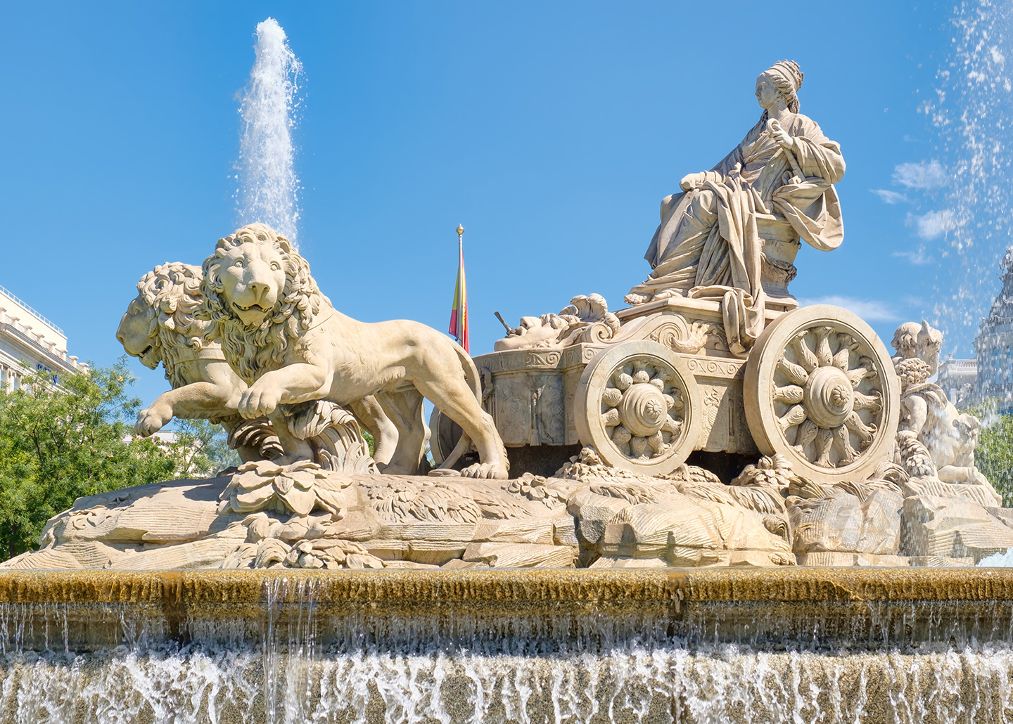 "Statue of chariot pulled by two lions, on a fountain"