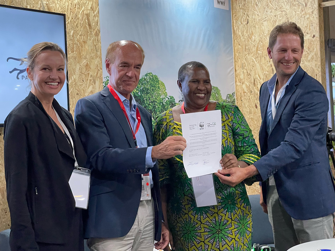 Group picture holding the Signed MoU