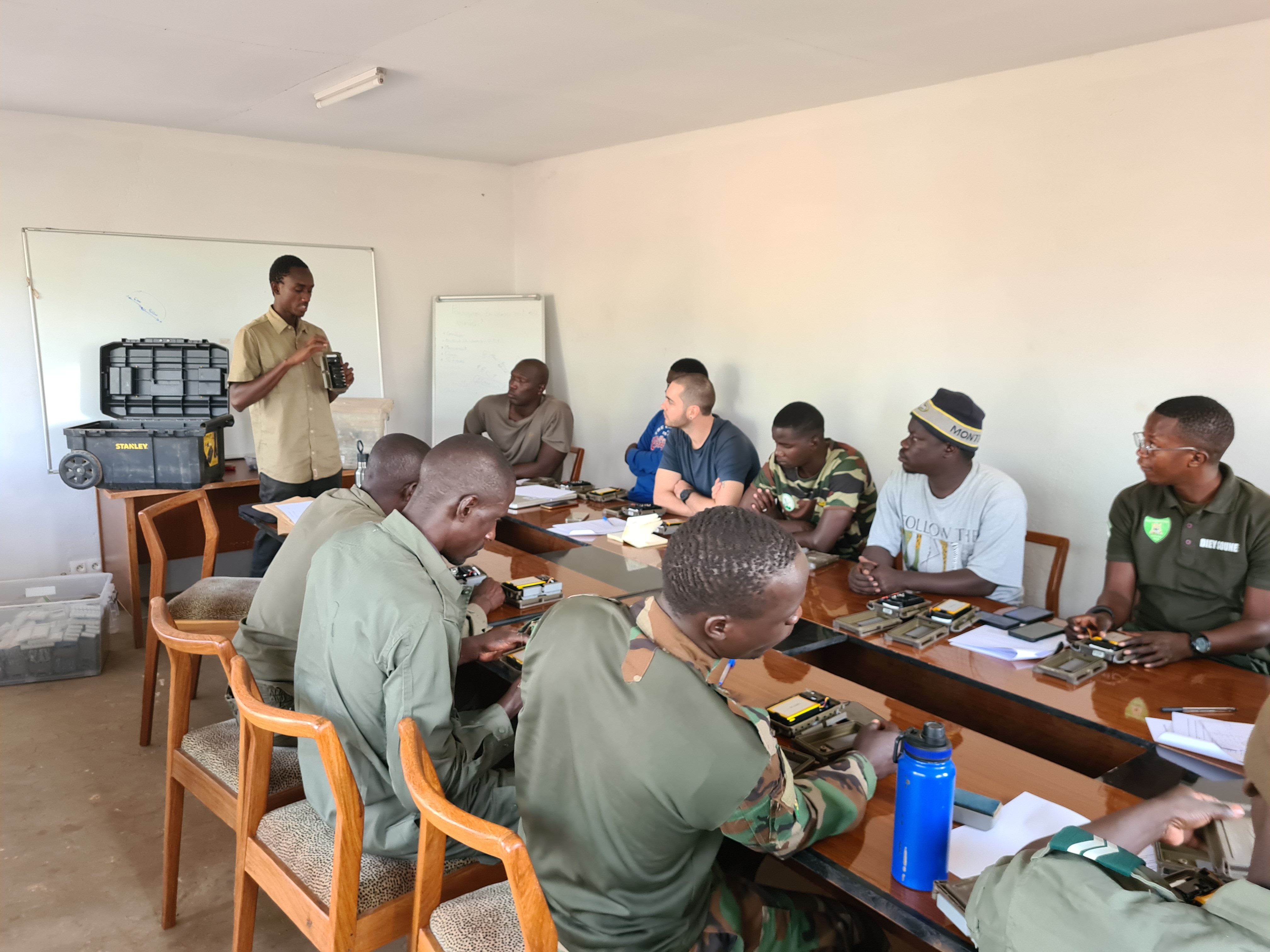 Panthera staff providing technical training to team leaders from the DPN and ZSL partners on operating and deploying the different camera models to be used for this survey.