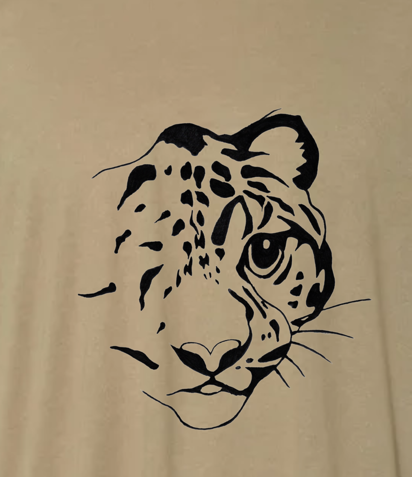 A custom t-shirt with Sunda clouded leopard artwork that Welneita designed as part of the local conservation branding.