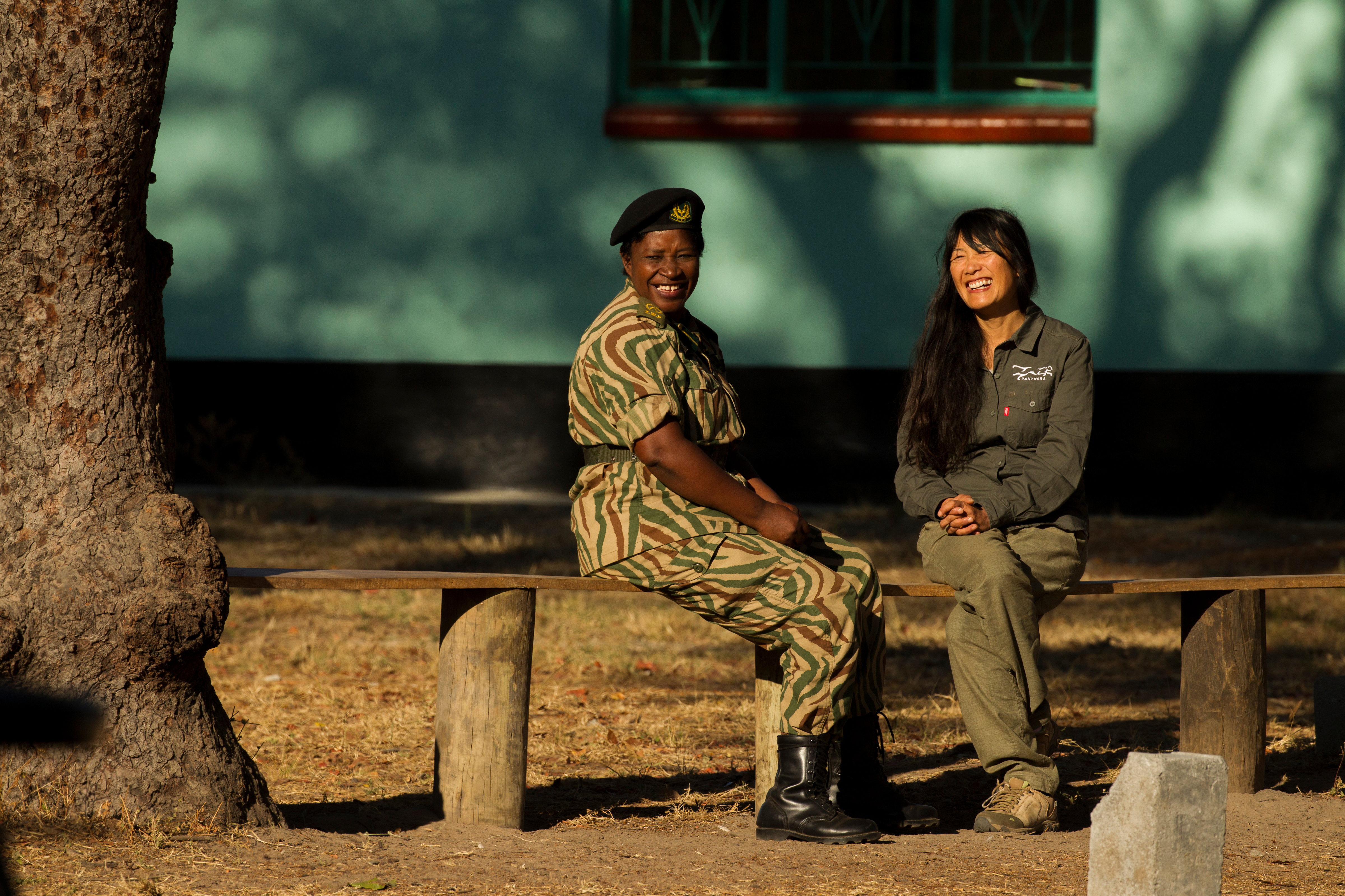 Two women sitting and sharing a laugh