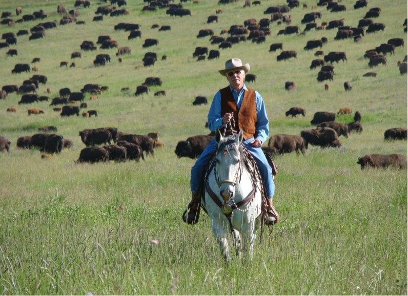 Ted Turner on horseback at his Montana ranch