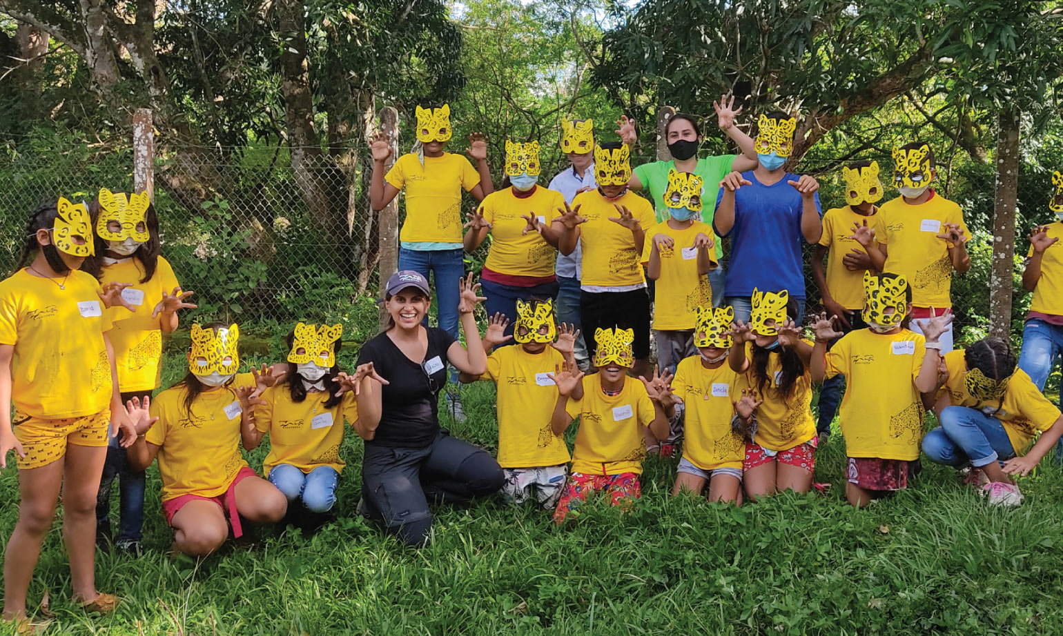 Students at Panthera's Jaguar School in Colombia wearing cat masks