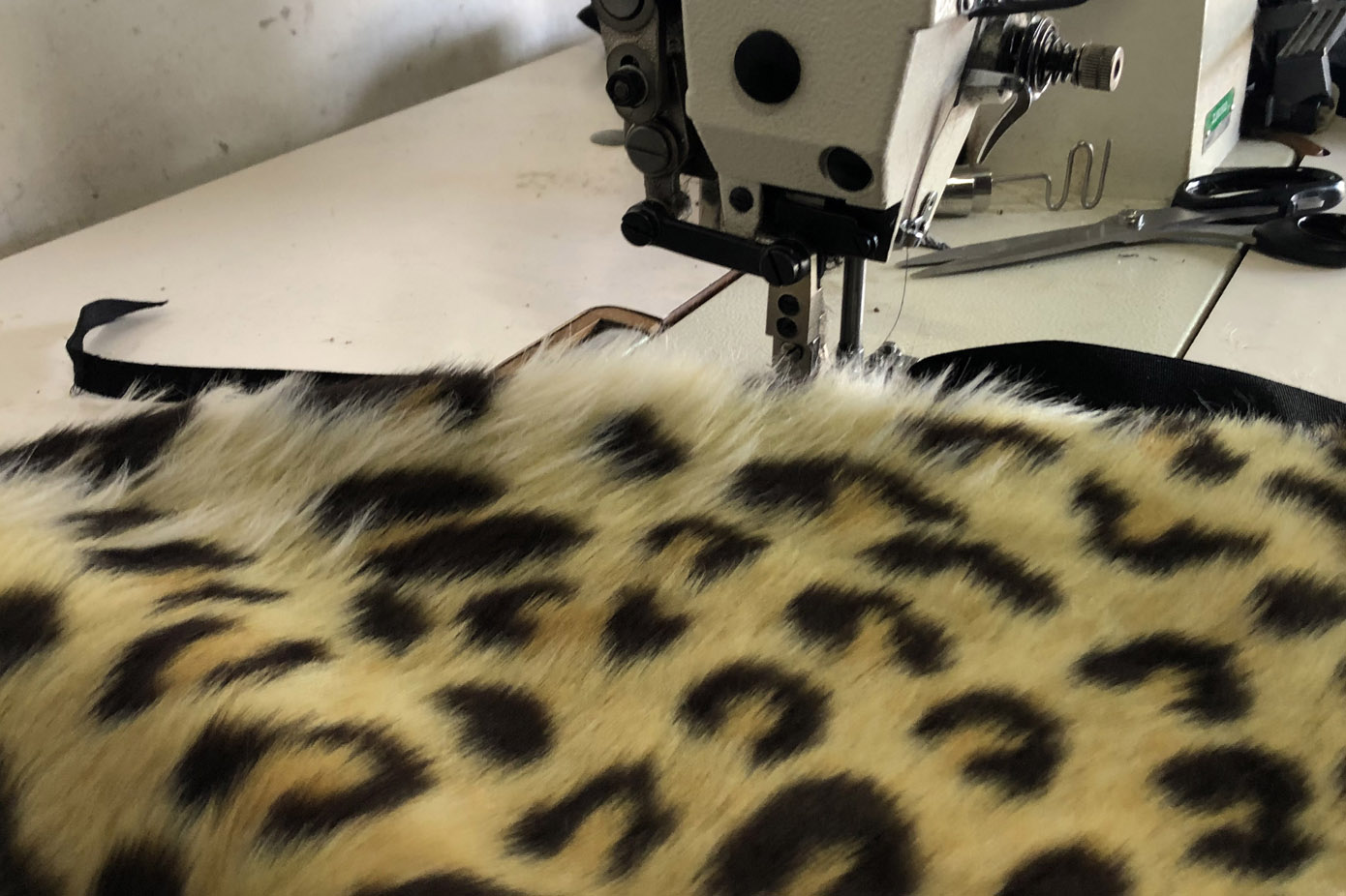 Sewing synthetic leopard fur  