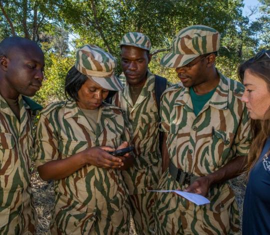 A Panthera staff member trains rangers on SMART technology.