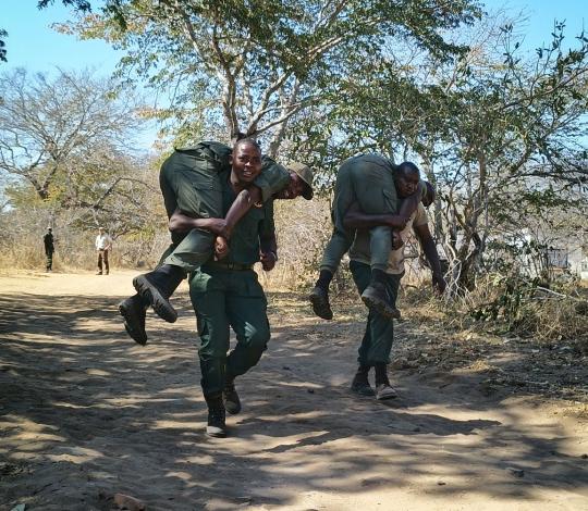 Rangers practice fireman carry in Hwange National Park