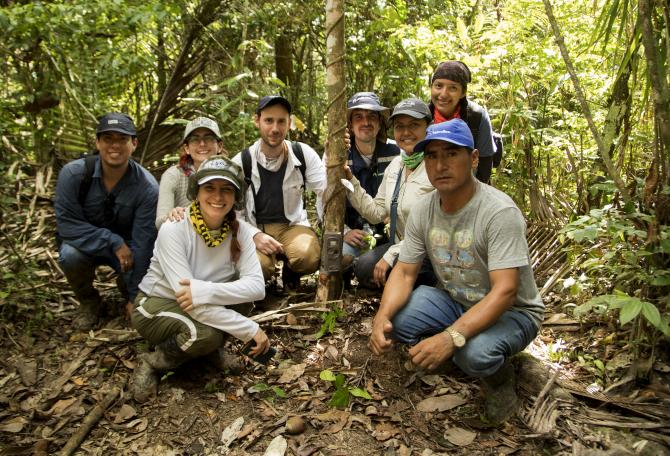 A group of Panthera staff in the forest