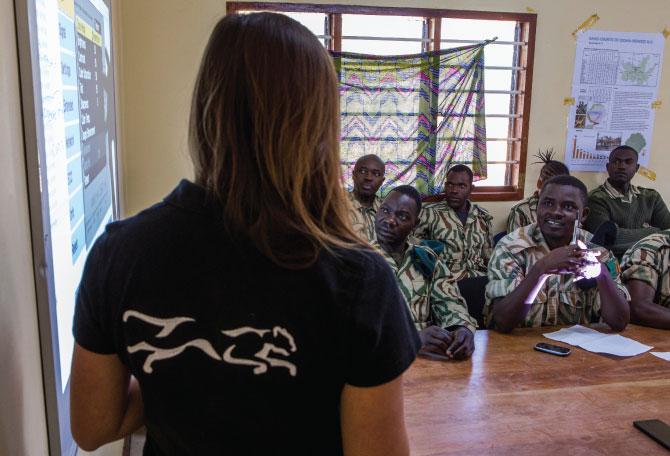 Conservationist, Xia Stevens, teaching anti-poaching scouts about SMART program