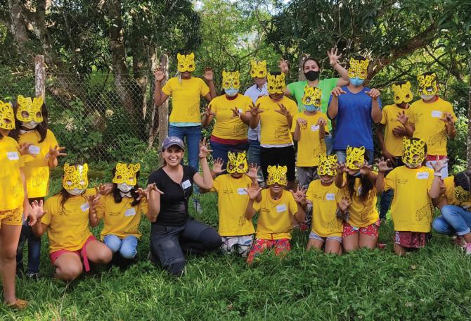 Students at Panthera's Jaguar School in Colombia wearing cat masks